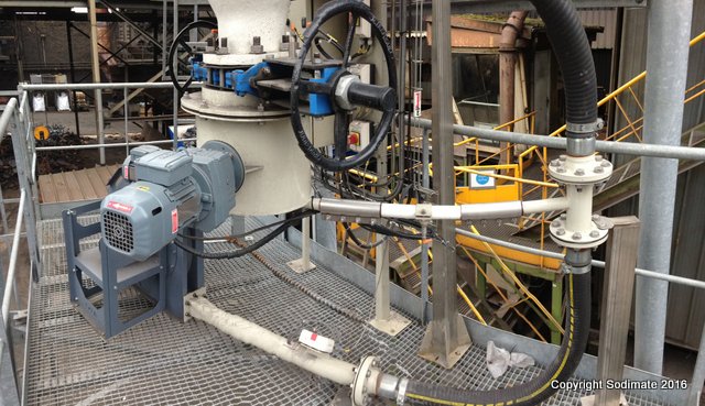Dévoûteur doseur alimentant le transfert pneumatique